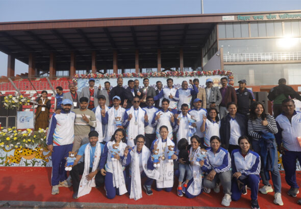 Athletes pose for a group photograph.