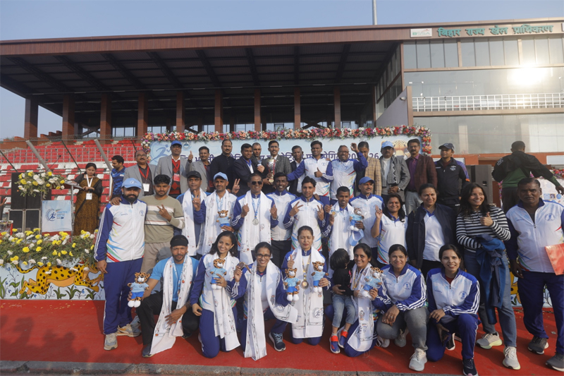 Athletes pose for a group photograph.