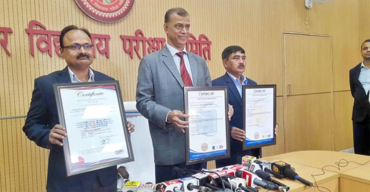 Bihar Board Chairman Anand Kishor with the award