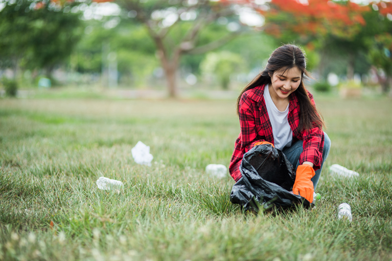 Woman collecting garbage