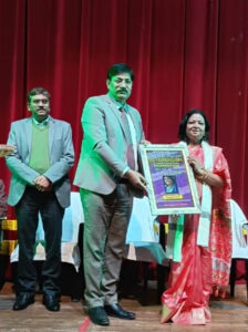 Reena Sopam receiving the award