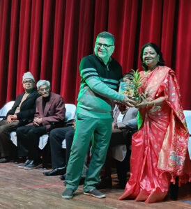 Reena Sopam receiving the award