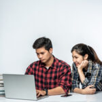 A boy working on a computer.