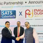 63SATS Cybertech MD & CEO Neehar Pathare joins hands with Dr. Pawan Duggal for a strategic alliance in front of 63SATS Chairman Lt. Gen M U Nair during CyberSec Expo in Mumbai