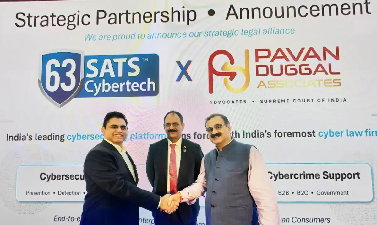 63SATS Cybertech MD & CEO Neehar Pathare joins hands with Dr. Pawan Duggal for a strategic alliance in front of 63SATS Chairman Lt. Gen M U Nair during CyberSec Expo in Mumbai