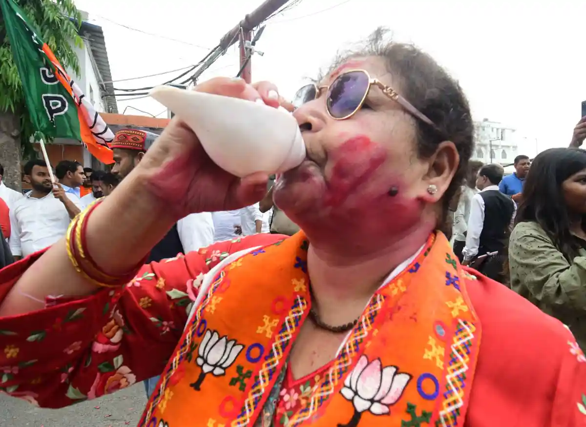 A Bihar BJP worker celebrates party's victory in Assembly elections at state headquarters in Patna.