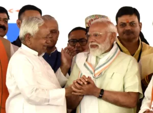 Former Bihar Chief Minister and JD(U) chief Nitish Kumar greets Prime Minister Narendra Modi during the oath taking ceremony of the new Bihar ministers at Gandhi Maidan in Patna. 