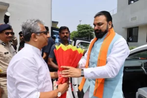 Bihar IT Minister Nitish Mishra greets Bihar Chief Minister Samrat Choudhary during Bihar AI Summit 2026 in Patna.