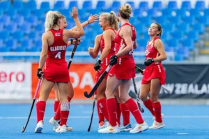 USA team celebrates after scoring a goal against Chile.
